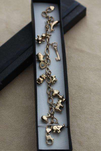 9 CT GOLD CHARM BRACELET
